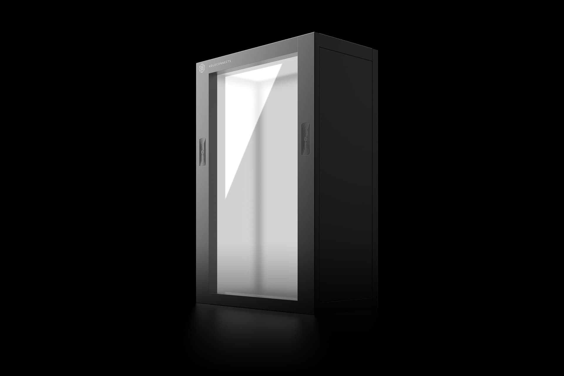 The Holoconnects Holobox, a black cabinet with a transparent display panel, seen from the front at an angle.